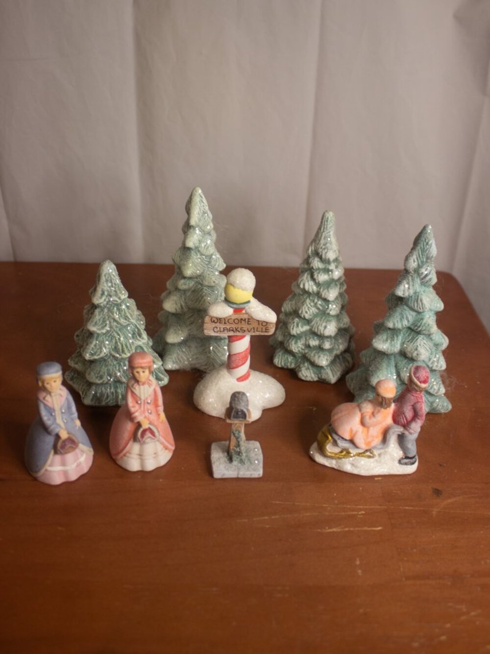 Holiday Village Figurines – Mixed Lot with Trees & Clarksville Sign